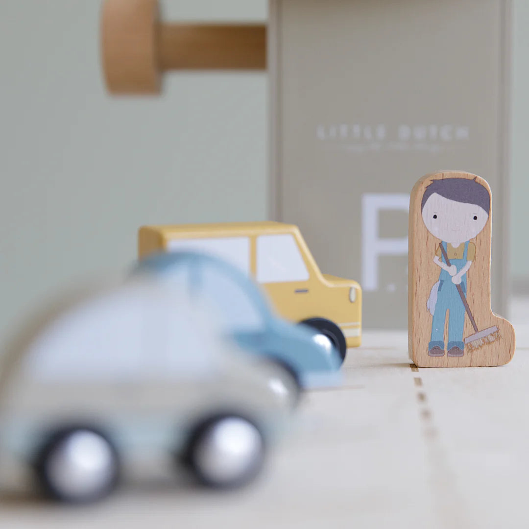 The Little Dutch Garage comes with wooden cars and people ready to play with