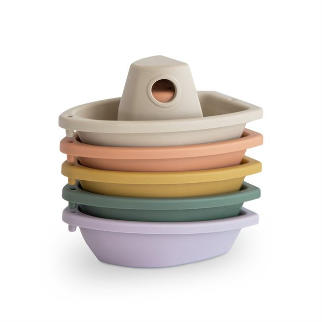 5 stacked plastic bath boats in rustic colours