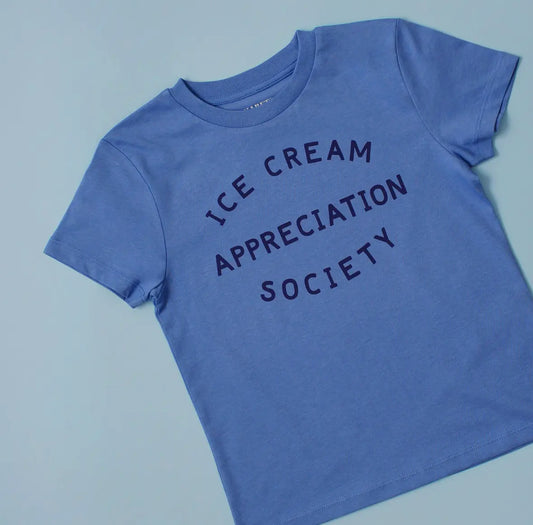 A blue children’s t shirt screen printed with ice cream appreciation society