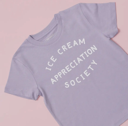 A lilac children’s t shirt screen printed in white with ice cream appreciation society 