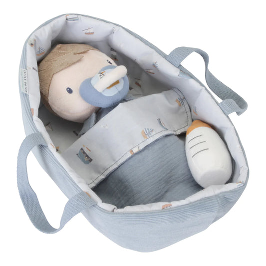 Little Dutch Baby Jim Doll in a moses basket showing magnetic dummy in use