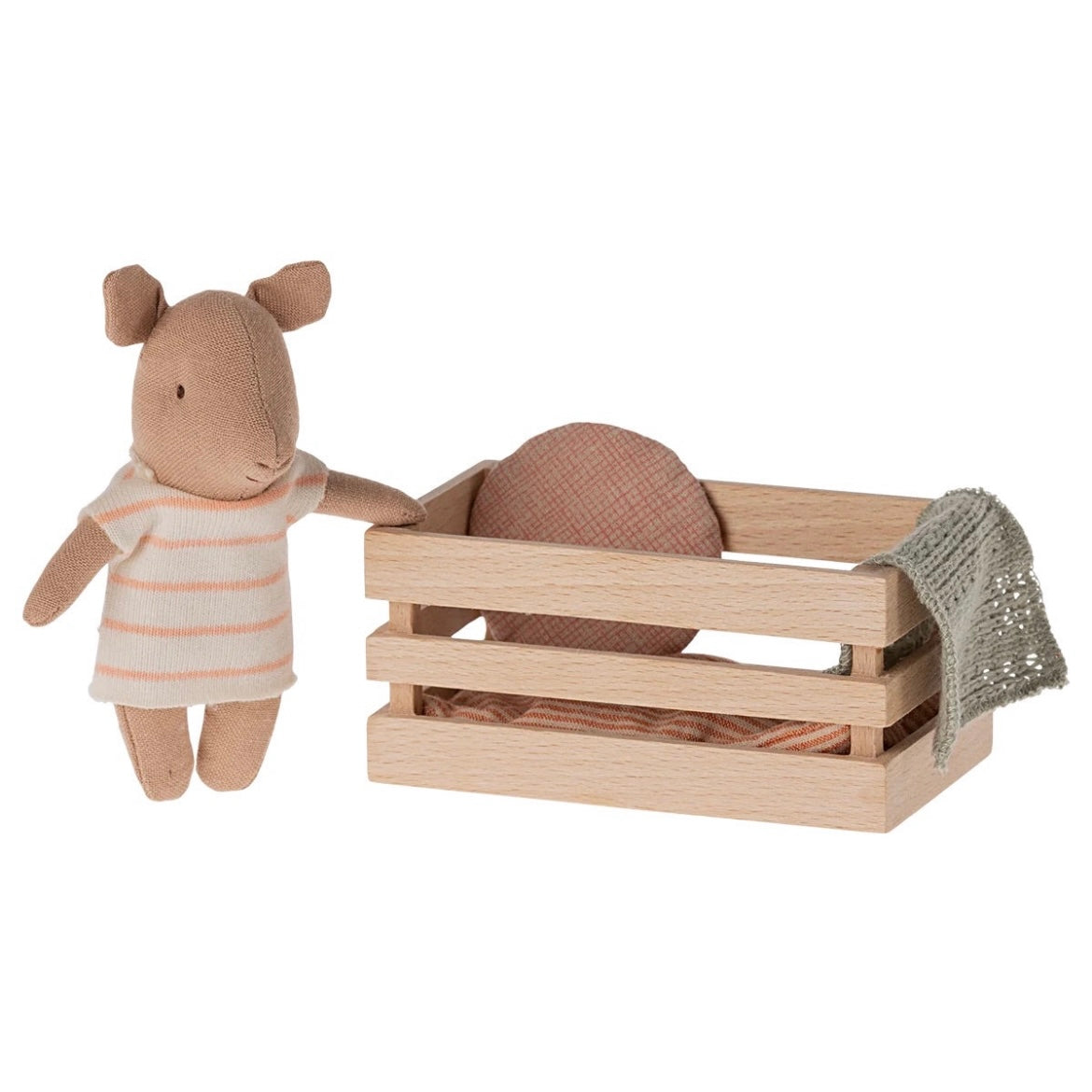 a little Maileg pig complete with a wooden crate box and bedding in a pink and white stripey outfit