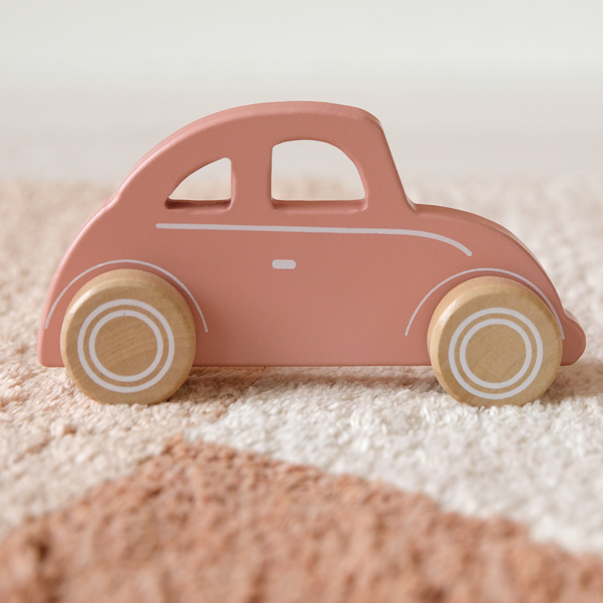 Little Dutch Pink Wooden Car on a rug