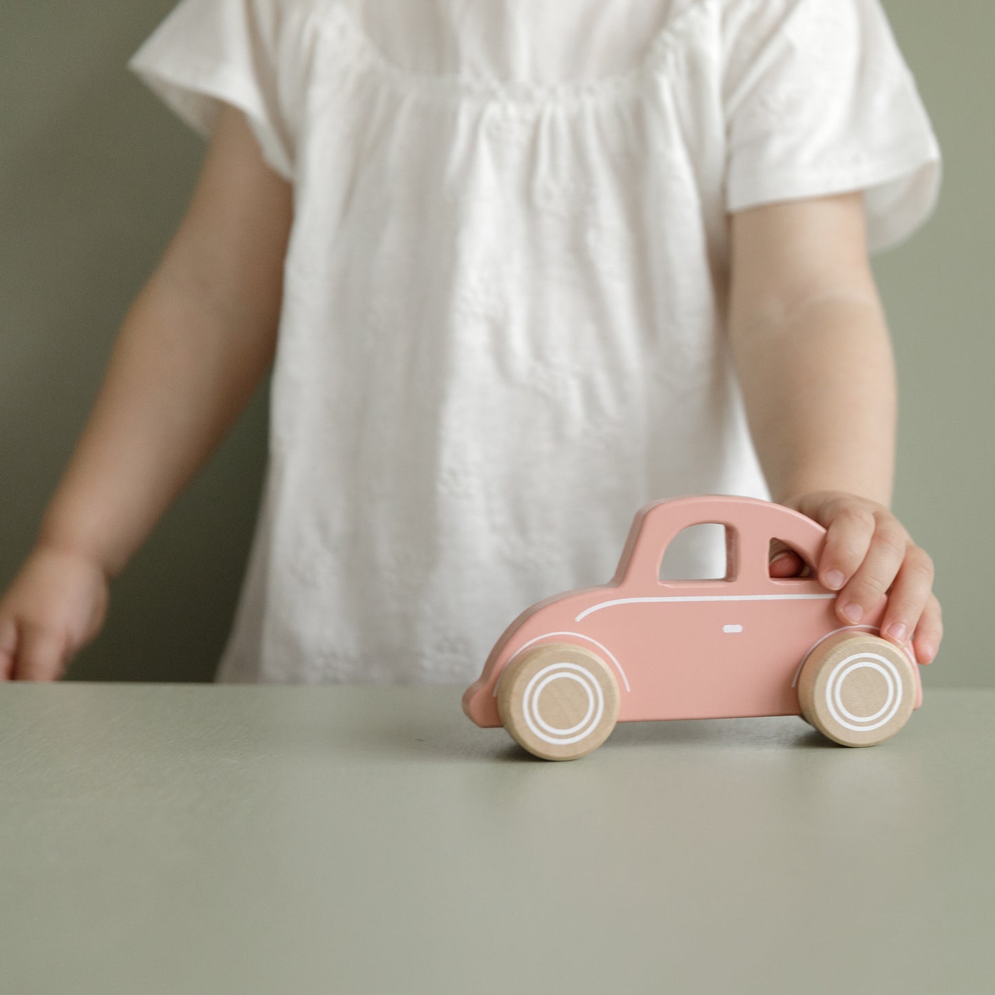 Little Dutch Pink Car in a childs hand