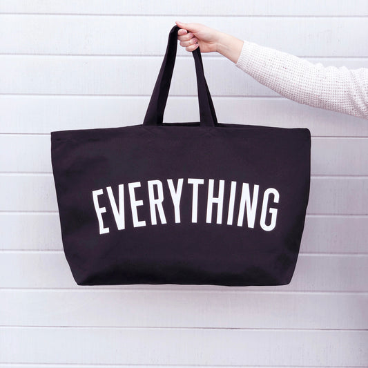 black tote bag with the word everything screenprinted in white