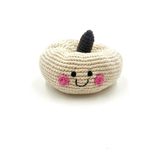 white pumpkin rattle with a smiley face from pebblechild