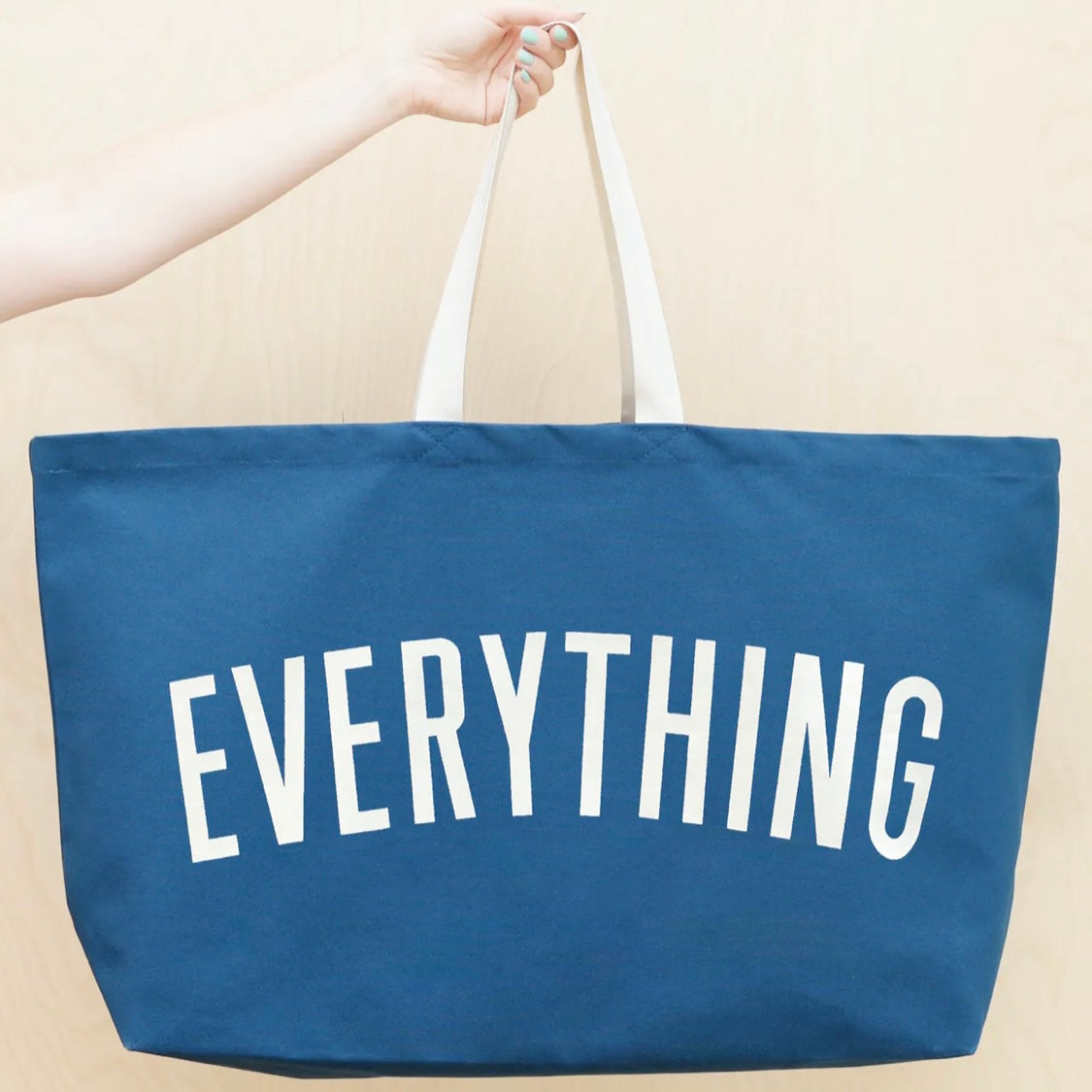 ocean blue tote bag screenprinted with the word everything